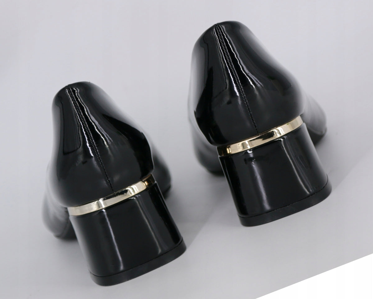 Black high-heeled shoes with gold bands 